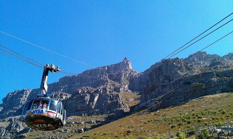 South africa safari vacation — cable car over table mountain in south africa.