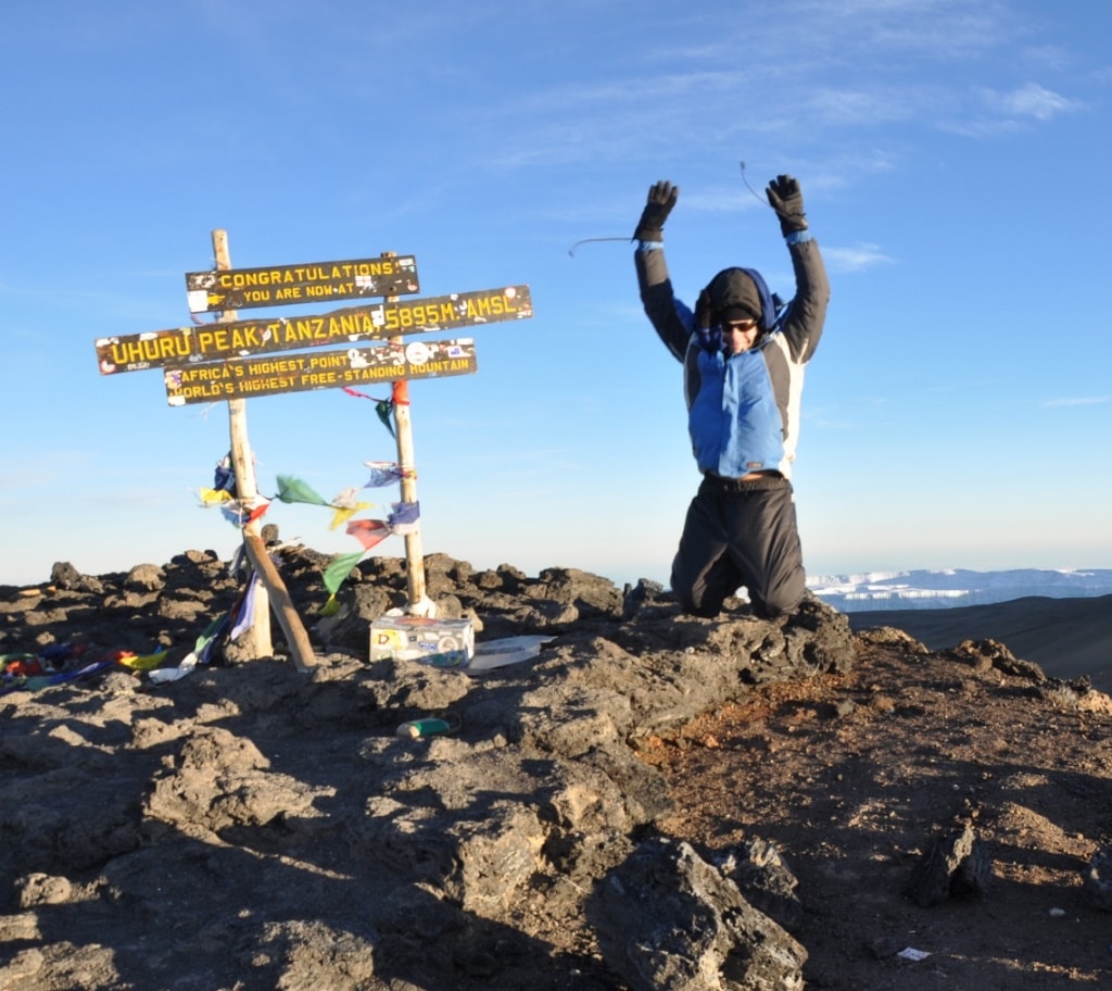 Climbing the Kilimanjaro for Charity — Man Jumping at the Summit of Mount Kilimanjaro, Tanzania.