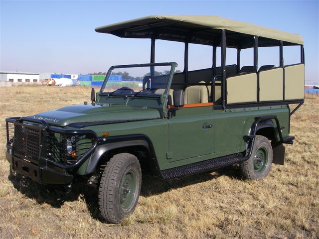 African big five animals — land rover defender game drive vehicle for use in the kruger national park.