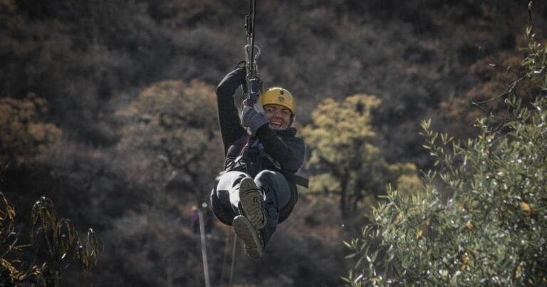 Best Zip Lines in South Africa — Woman Ziplining in South Africa.