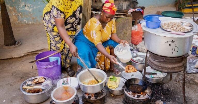 Traditional foods of south africa — african women cooking traditional food in the street, south africa.