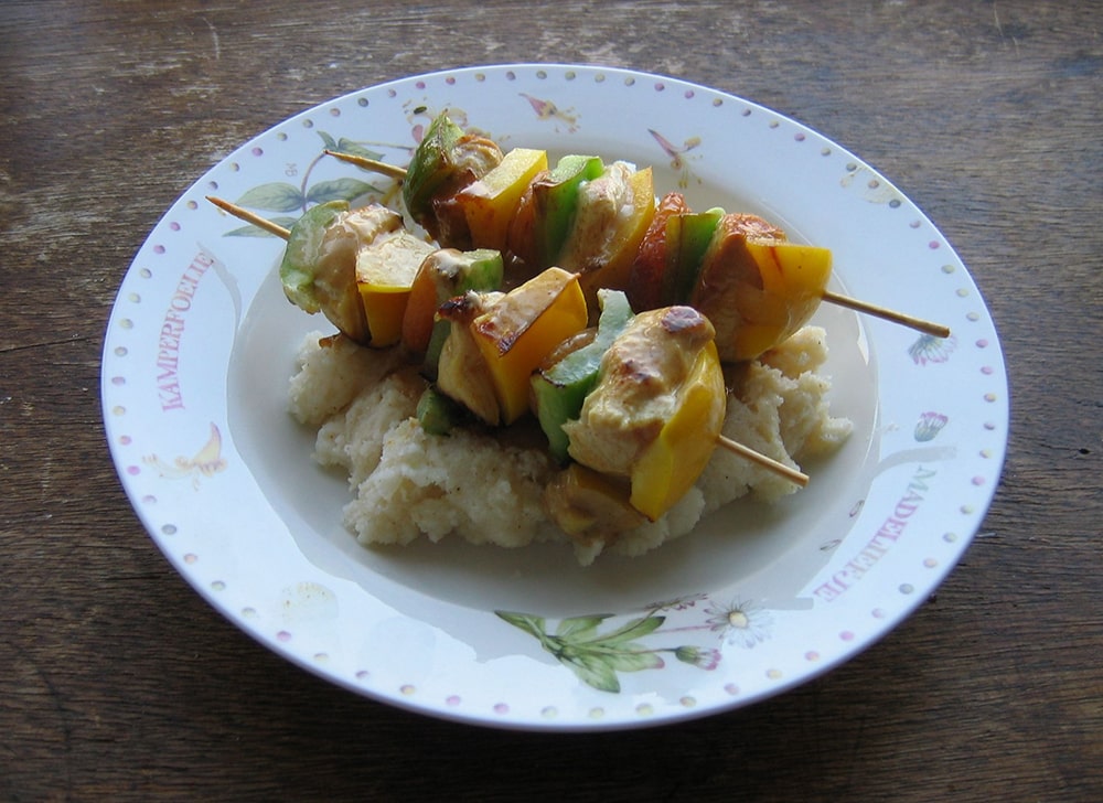 Sosaties with green and yellow peppers and dried apricot served with pap.